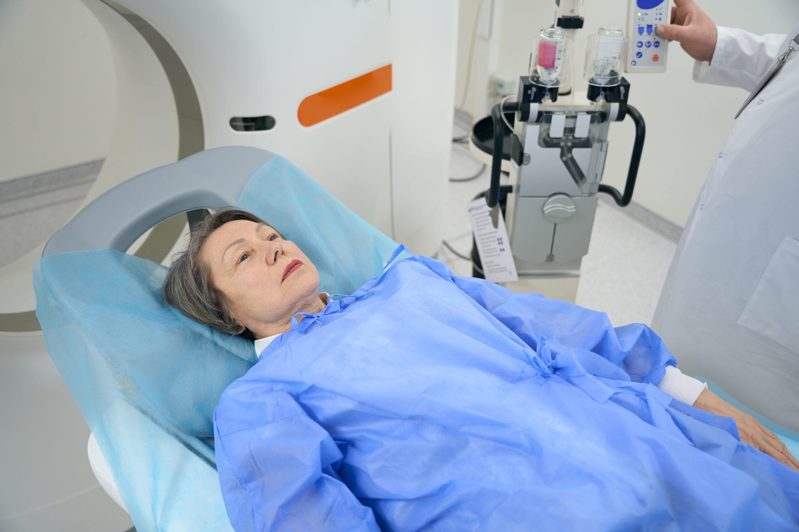 Patient resting on a treatment table before a scan